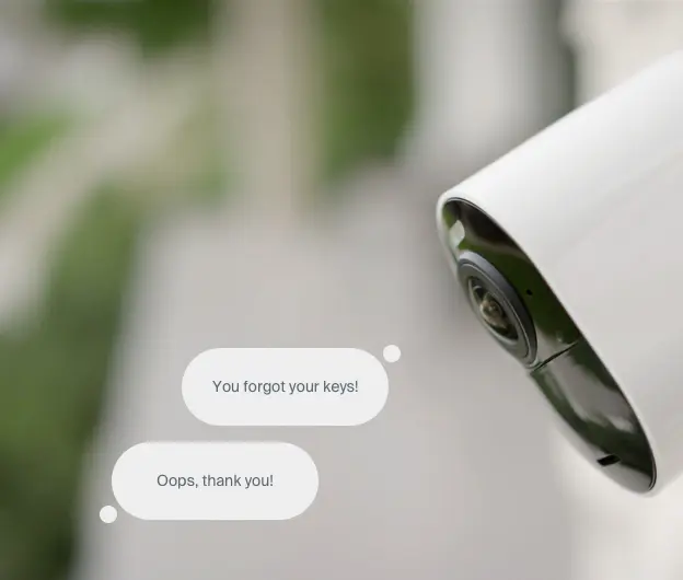 Image of Arlo security camera with conversation bubbles reading "You forgot your keys!" and "Oops. Thank you!"